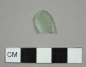 Thin curved aqua glass fragment, possibly from a bottle or lamp chimney