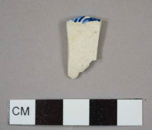 Blue shell edged pearlware rim sherd to a plate