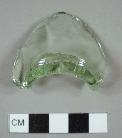 Green bottle glass base fragment with a kick-up, possibly from a pharmaceutical bottle