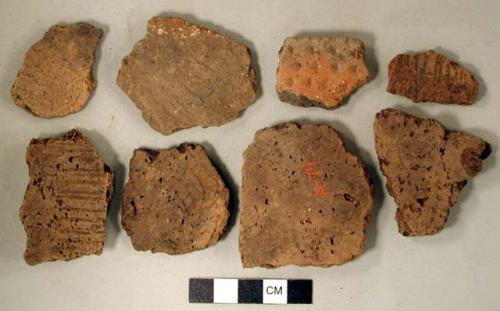 Coarse earthenware body and rim sherds, punctate, cord-impressed, rocker dentate