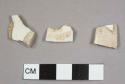 Two pearlware sherds, including one plate rim sherd, and one creamware sherd