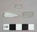 Colorless flat glass fragments, one frosted, possibly during deposition