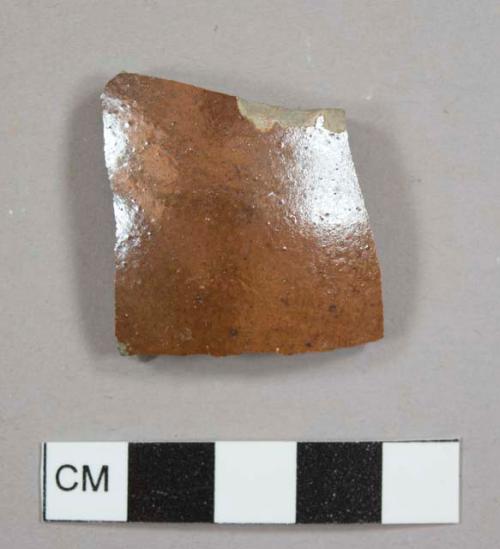 Brown glazed stoneware sherd with lustrous exterior