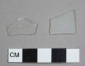 Colorless flat glass fragments, including one possibly burned or handmade