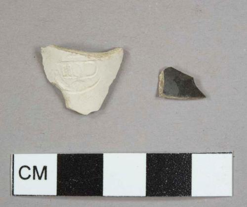 Kaolin/White ball clay pipe bowl fragment with burnt interior and exterior, stamped maker's mark: "IID"