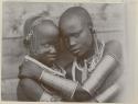 Two women with arm rings