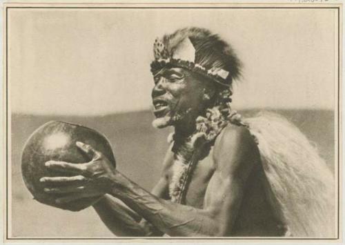 Man holding vessel of beer