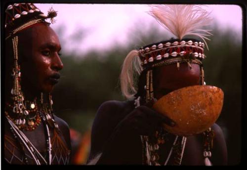 Gerewol dancer drinking from calabash - Niger
