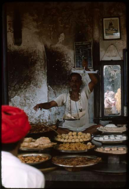 Man with red turban in shop - Pushkar, India
