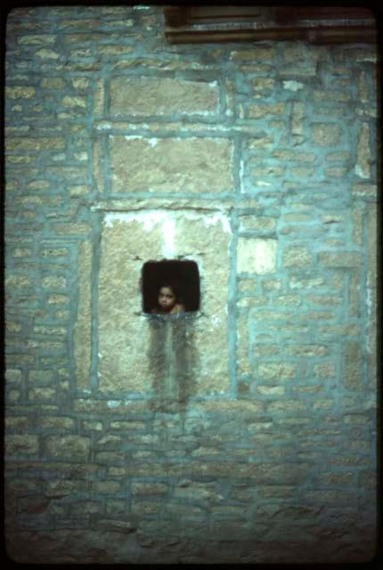 Child in window - Ramdeora, Jaisalmer, India
