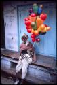 Man with balloons - Benares, India
