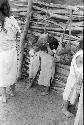 Ika children in corral drinking milk








