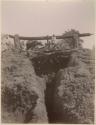 Men and ox on a structure over a well or mine