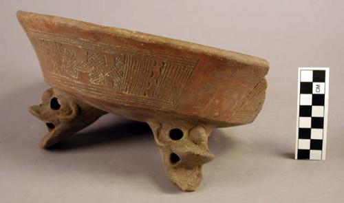 One pottery tripod bowl, incised red ware