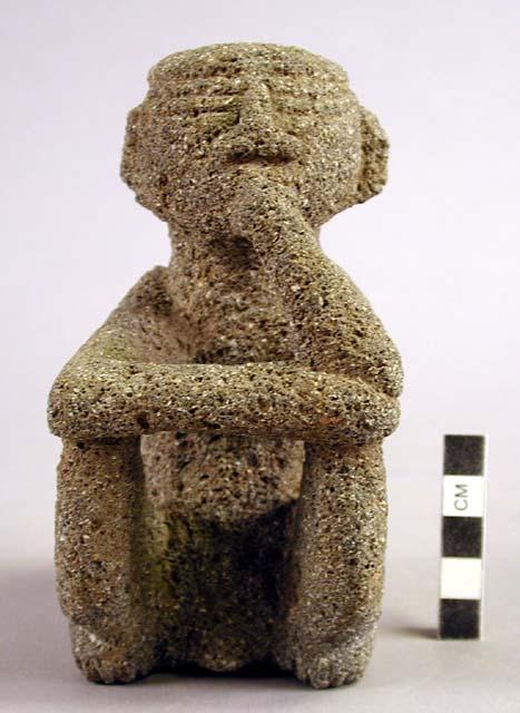 Small stone seated figure