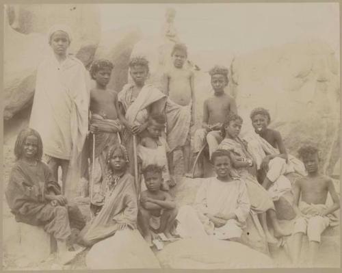 Group of children sitting on rocks