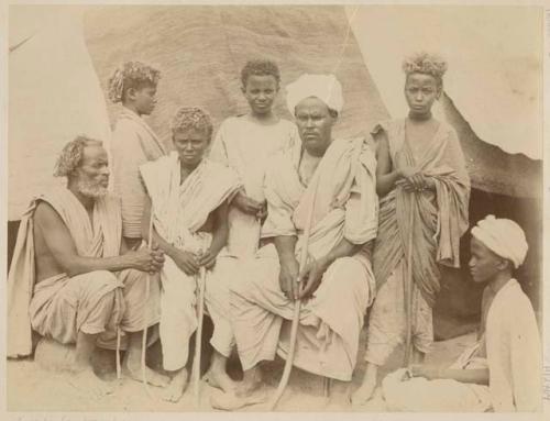 Group of men and boys in front of a tent