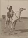 Man on a camel holding a spear
