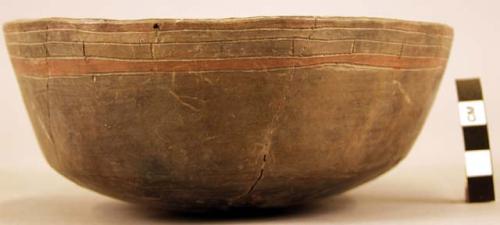 Restored straight-sided flaring pottery bowl