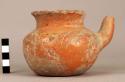 Small red polychrome pottery jar with spout - bichrome ware