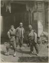 Three Chinese workmen on street