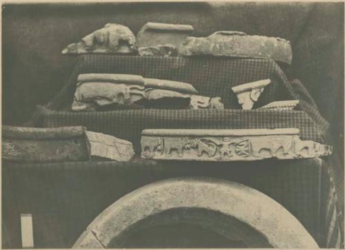 Fragments of bowls made of soapstone and decorated with carvings of bulls and zebras