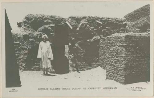 Man standing in front of a house