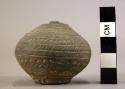 Ceramic miniature jar, black, flat base, round body, incised and punctate design