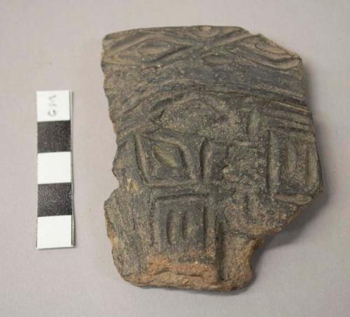 Black incised potsherd