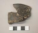 Black incised potsherd