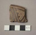 Black incised potsherds