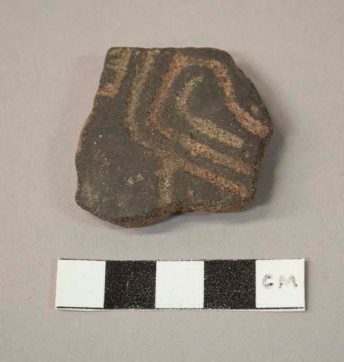 Black incised potsherd