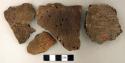 Coarse earthenware body and rim sherds, cord impressed, one undecorated