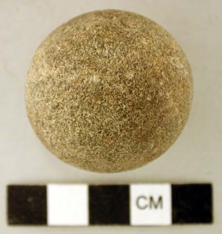 Ground stone, sphere, partially grooved, possible plummet