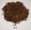 Head ornament of twisted human hair string