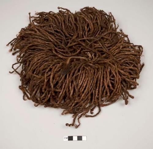 Head ornament of twisted human hair string