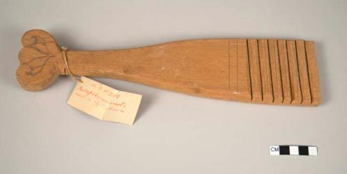 Wooden paddle for making pottery - lines cut across ends