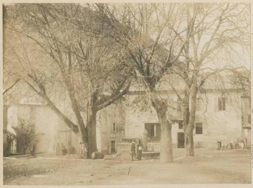 People in front of buildings