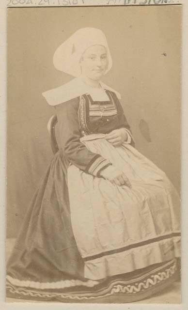 Studio portrait of a woman sitting