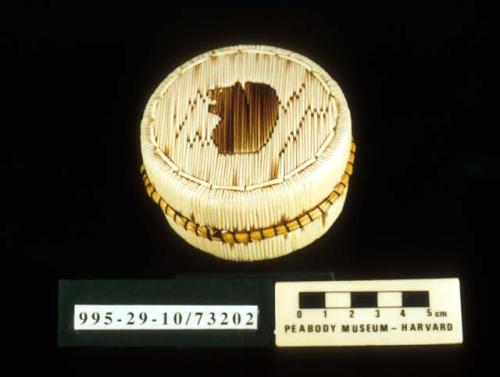 Fully-quilled birch bark basket (A) with lid (B); squirrel motif