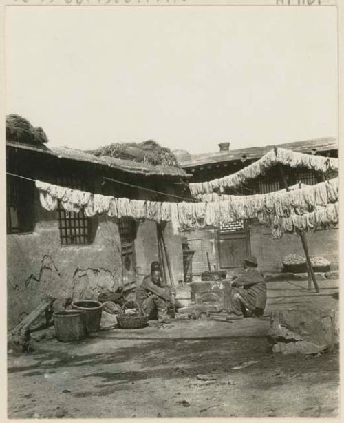 Courtyard of a carpet factory with wool hung ready for dyeing