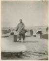 Woman with bound feet exercising on roof