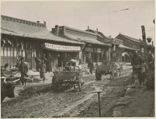 Main street with farm carts and people