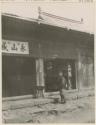 Man outside pipe and tobacco shop