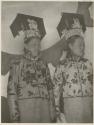 Two Manchu females in headdresses and ornate coats