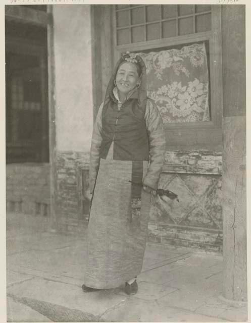 Woman of high society holding bag and wearing large earrings