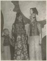 Two Manchu ladies and small boy all with ornate clothing
