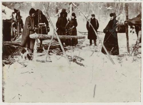 Group of people and dog outdoors