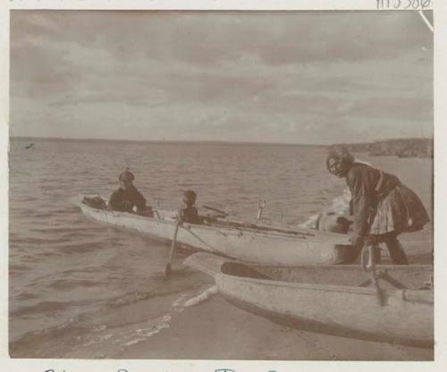 Family in boat on coast