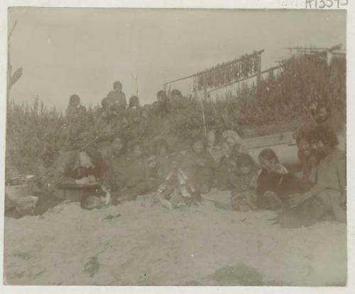 Group on beach, with man mapping the coast